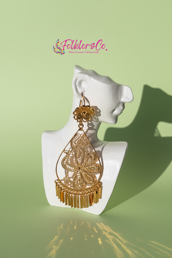 Gold earrings on a white mannequin bust with 'Folkloryco.' branding on a light green background.