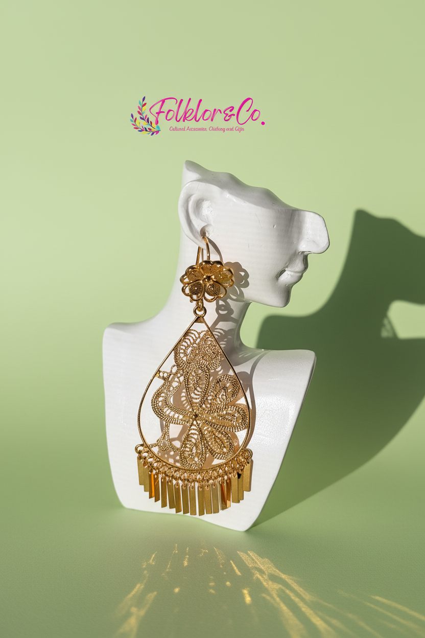 Gold earrings on a white mannequin bust with 'Folkloryco.' branding on a light green background.