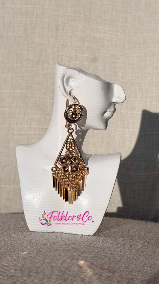 Mexican filigrana earrings on a white mannequin bust with 'Folkloryco' branding against a neutral background.