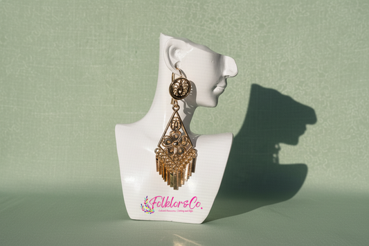 Gold Mexican Folklorico earrings on a white mannequin head with 'Folkloryco.' branding on a green background